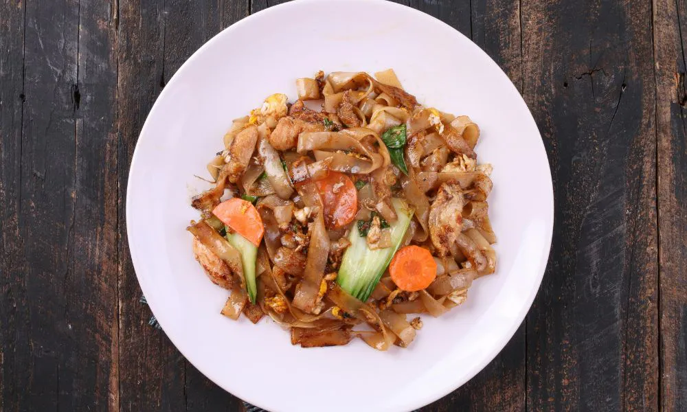 Chicken stir-fried wide rice noodles with vegetables and egg at The Imperial Treasure, a Chinese restaurant in Matthews